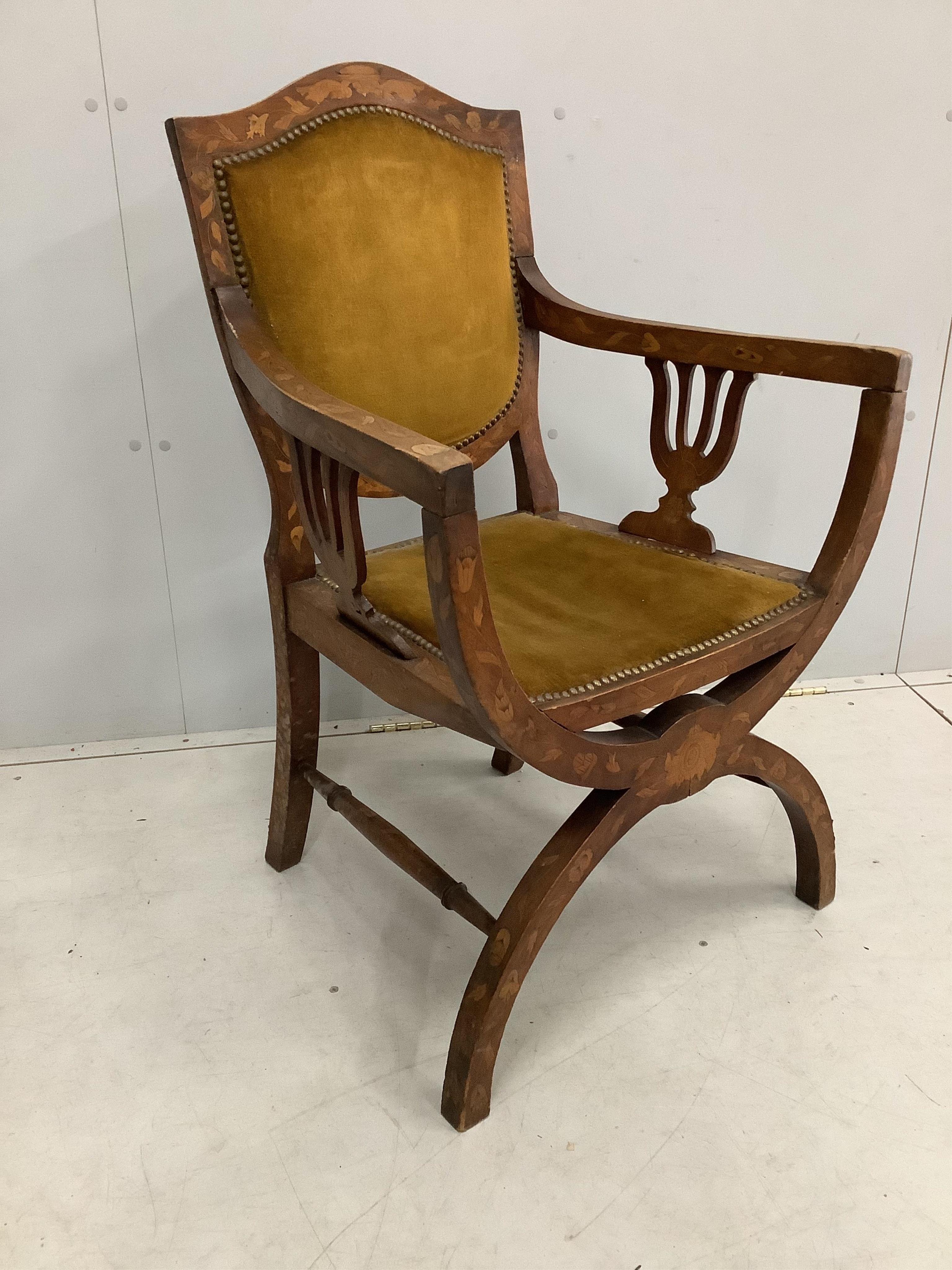 A 19th century Dutch floral marquetry inlaid X frame elbow chair, width 61cm, depth 45cm, height 94cm